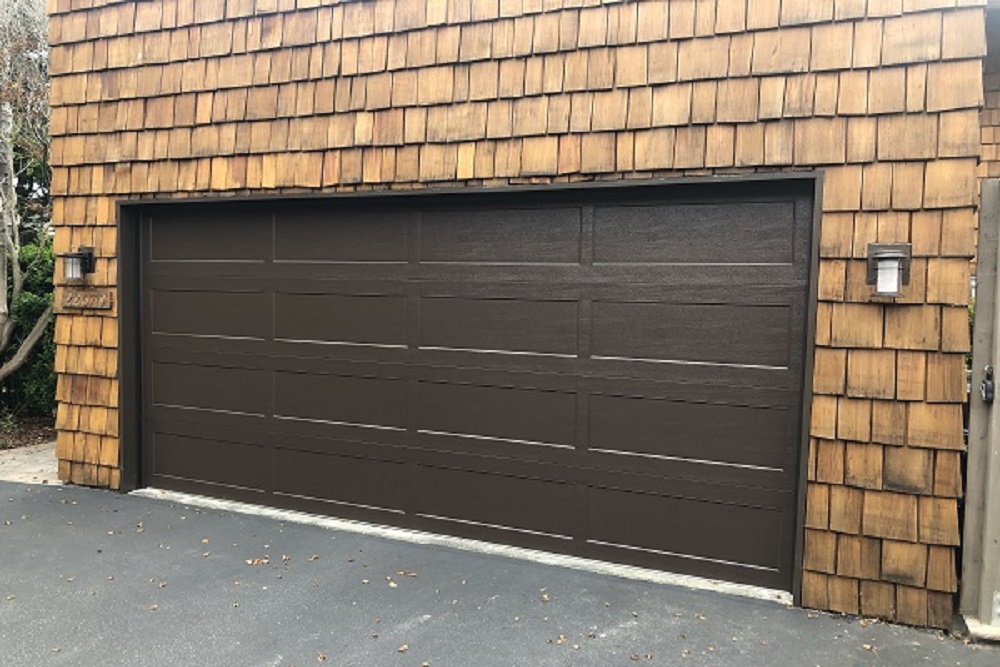 How do you identify and fix garage door sensor issues?